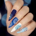 Multicolored,Blue,Nail,Art,On,A,Long,Sharp,Shape,Of